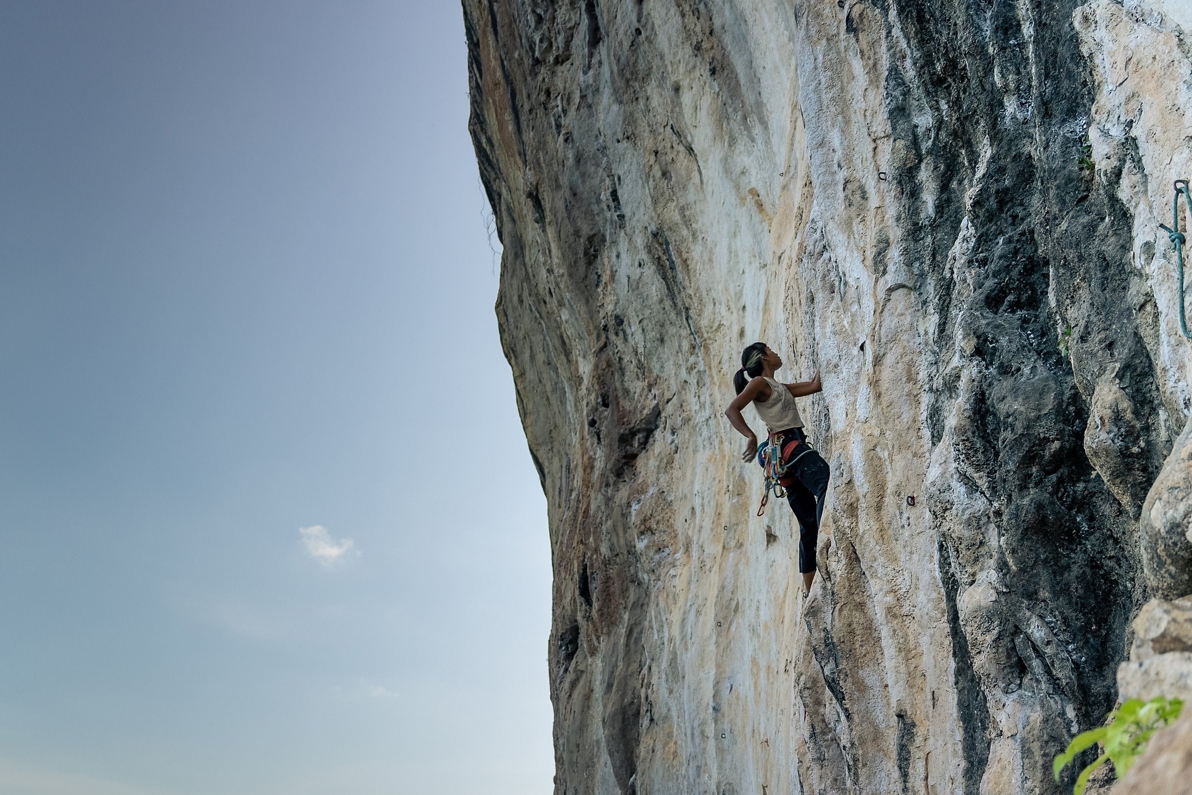 Climber on a bolted limestone face, Krabi