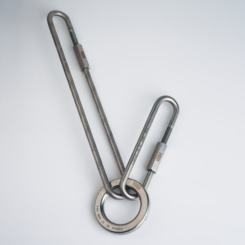 Titanium lower-off ring connected to titanium quick links as a single-metal anchor