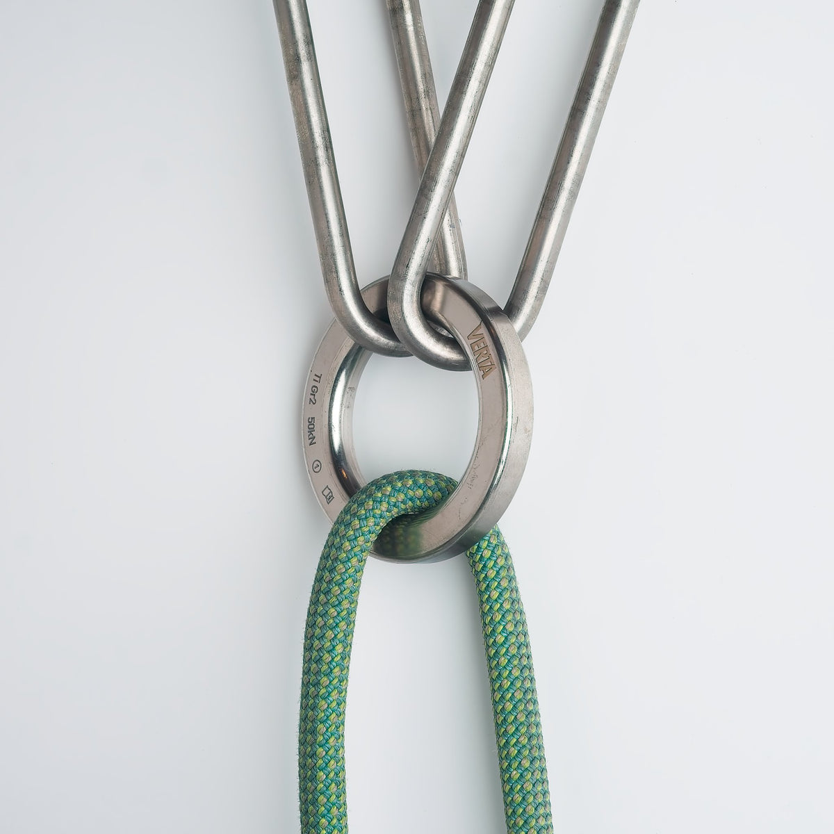 Climbing rope running through a forged titanium lower-off ring