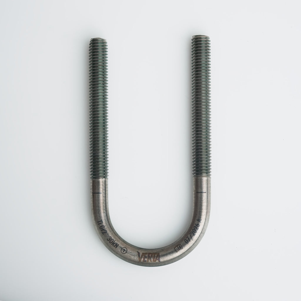 Titanium glue-in U-bolt anchor showing the rounded rod profile that reduces quickdraw wear